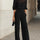 Valentina • Set da tre pezzi nero, composto da top camisole trasparente e pantaloni a gamba larga